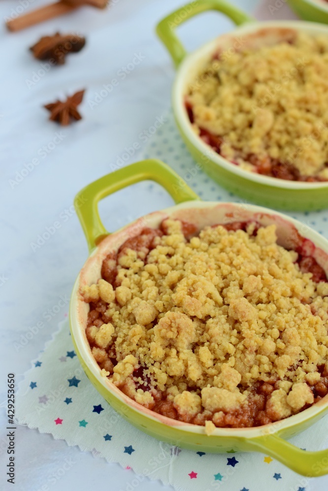 Plum crumble with spices on white background. Summer crispy fruit dessert. Tasty breakfast
Plum crumble with spices on white background. Summer crispy fruit dessert. Tasty breakfast