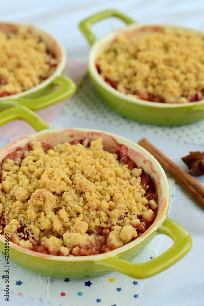 Plum crumble with spices on white background. Summer crispy fruit dessert. Tasty breakfast
Plum crumble with spices on white background. Summer crispy fruit dessert. Tasty breakfast