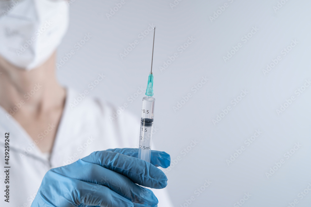 nurse preparing syringe for vaccination nurse preparing syringe for vaccination