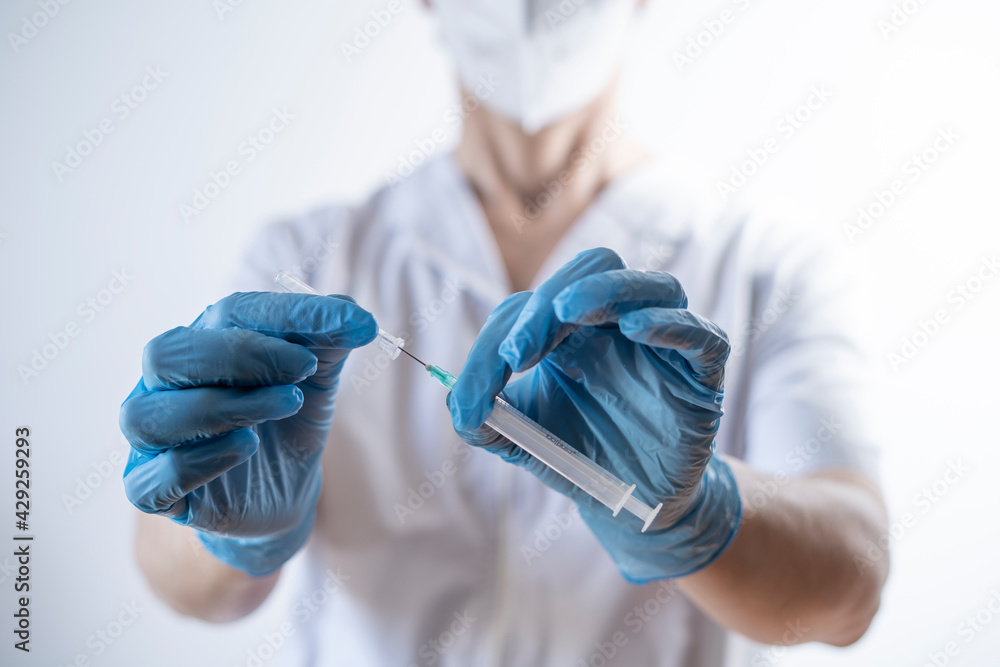 Fototapeta premium nurse preparing syringe for vaccination