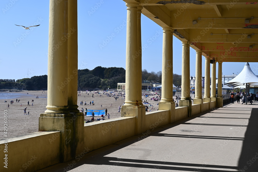Barry Island, Wales, UK - April 17, 2021: Barry is a vibrant coastal town with a bustling High Street, gorgeous parks and colourful beach huts.