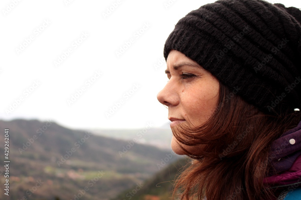 Beautiful girl watching the panorama in the mountains. From the town of Fosdinovo in Lunigiana, Italy. Beautiful girl watching the panorama in the mountains. From the town of Fosdinovo in Lunigiana, Italy.