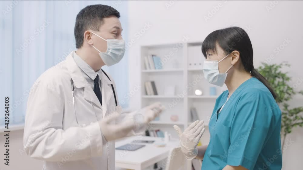 Angry doctor yelling at female intern for mistake strict boss scolding colleague Angry doctor yelling at female intern for mistake strict boss scolding colleague