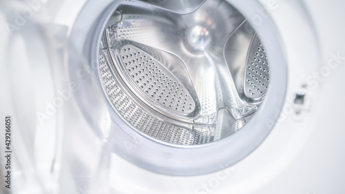 open door of an empty washing machine close up © Dmitriy Popov