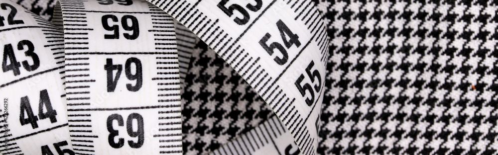 tape measure on a colorful fabric background tape measure on a colorful fabric background