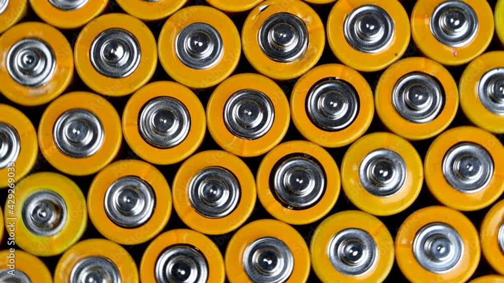 Many used AA alkaline batteries, finger batteries in heap ready for