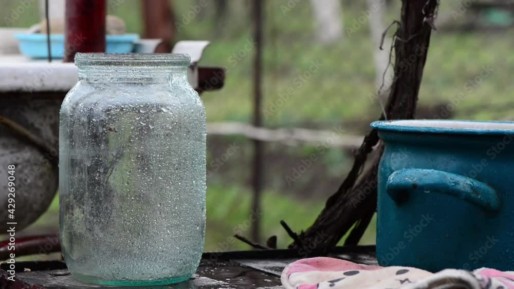 empty wet glass jar at rainy weather outdoor empty wet glass jar at rainy weather outdoor