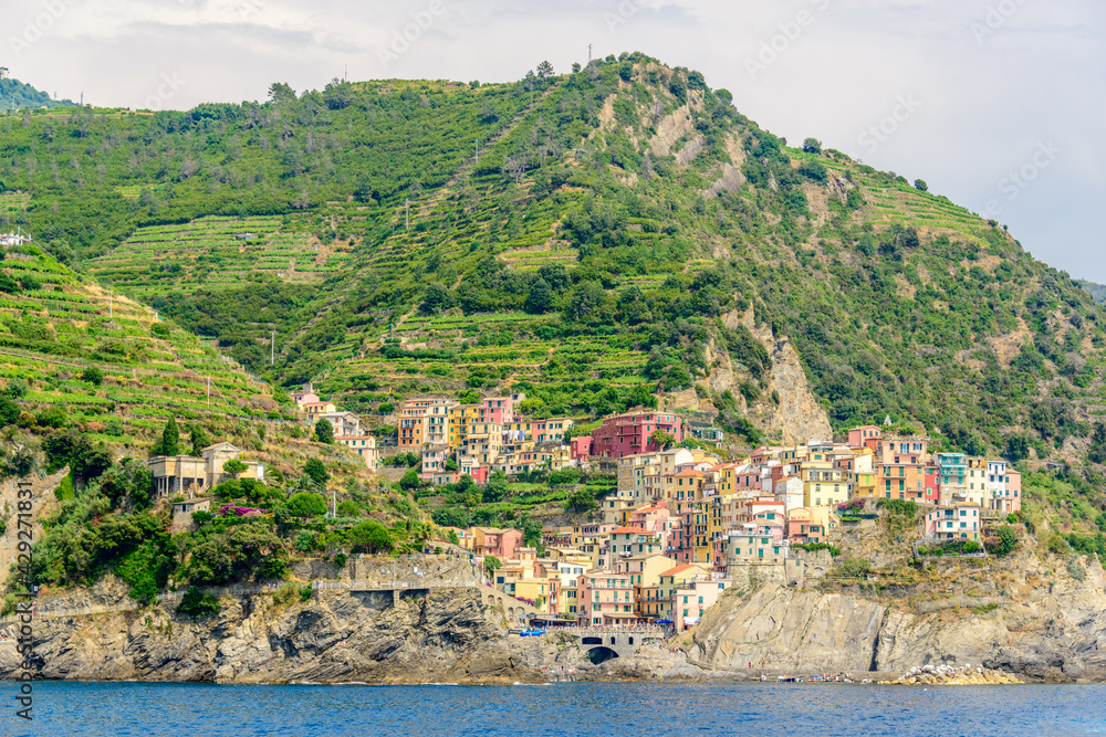 Manarola in Cinque Terre, Italy, view at the town from mountain trail