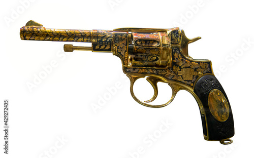   Golden revolver of the Nagan system-The first weapons factory in Tula, 1928. Isolated on white
