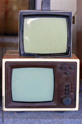 Many retro television. vintage old TV is colorful multi-row. Seeing the past. Pattern wall of old Antique television (TV)