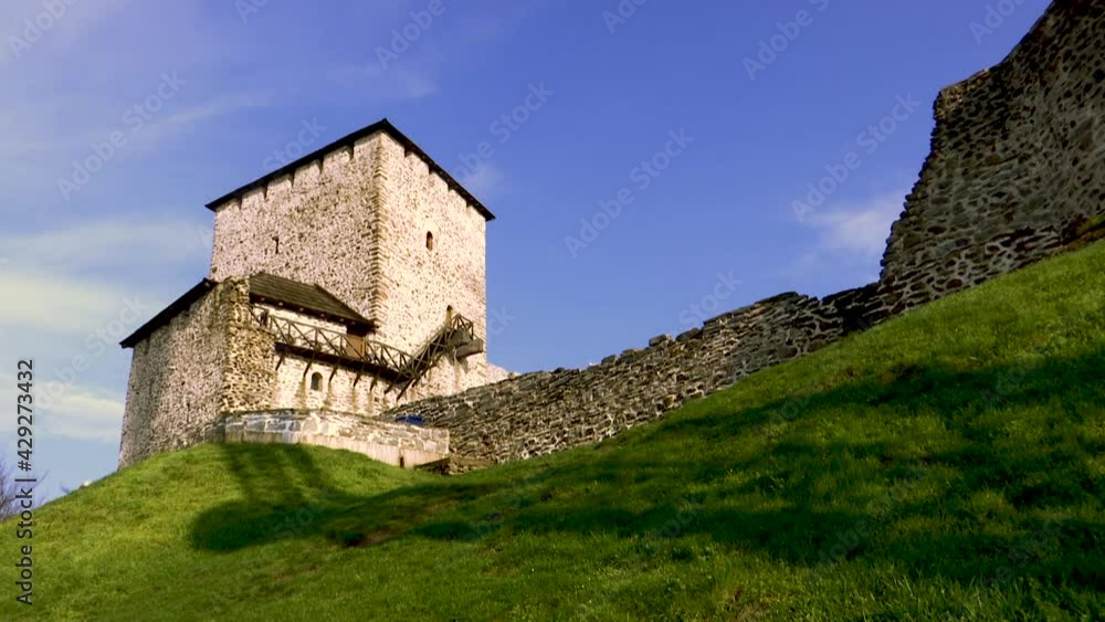 TIME LAPSE of a fortification stone fortification with a tower - shadow passes across the lawn TIME LAPSE of a fortification stone fortification with a tower - shadow passes across the lawn