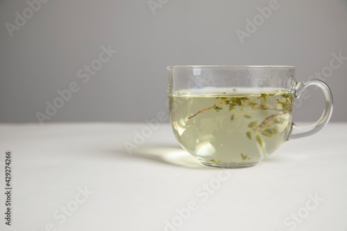 Glass cup of hot aromatic tea