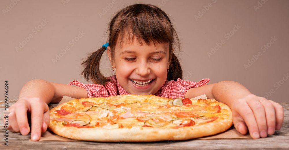 Huppy cute little girl with pizza. Child having fun eating dinner. Huppy cute little girl with pizza. Child having fun eating dinner.