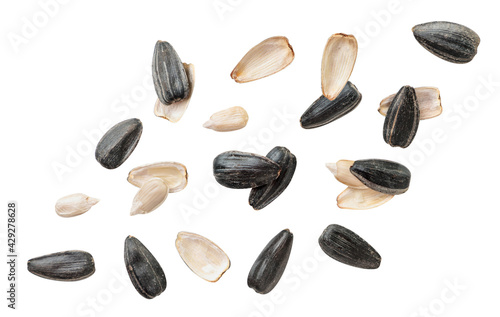 Sunflower seed peeled and not peeled fly on a white background. Isolated