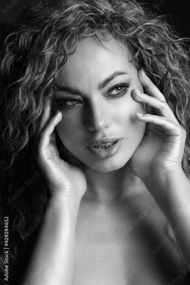 Passionate woman with curly hair and glowing skin Passionate woman with curly hair and glowing skin