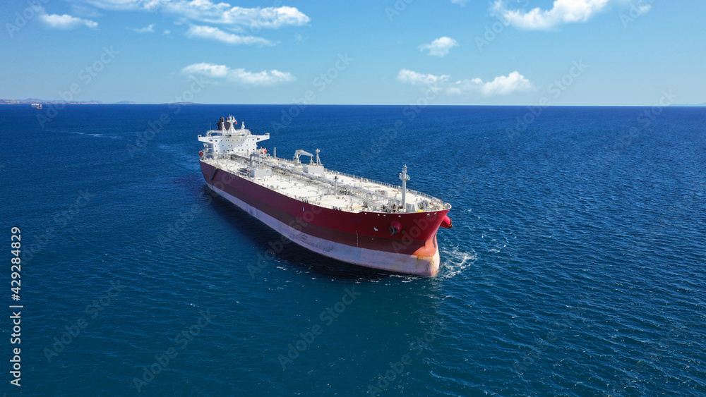 Aerial photo of industrial crude oil - fuel tanker ship cruising deep blue Mediterranean sea Aerial photo of industrial crude oil - fuel tanker ship cruising deep blue Mediterranean sea