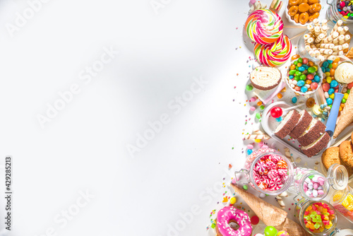 Selection of colorful sweets. Set of various candies, chocolates, donuts, cookies, lollipops, ice cream top view on white background
