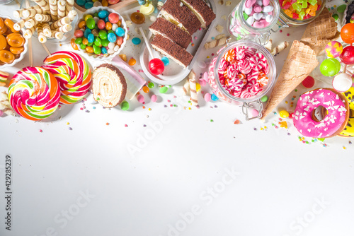 Selection of colorful sweets. Set of various candies, chocolates, donuts, cookies, lollipops, ice cream top view on white background