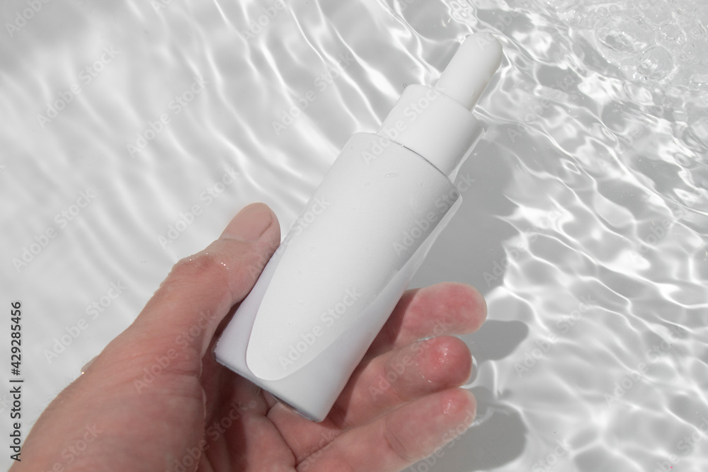 mockup of beauty fashion cosmetic makeup bottle lotion product with skincare healthcare concept on water pool background, hand holding bottle dropper mockup of beauty fashion cosmetic makeup bottle lotion product with skincare healthcare concept on water pool background, hand holding bottle dropper