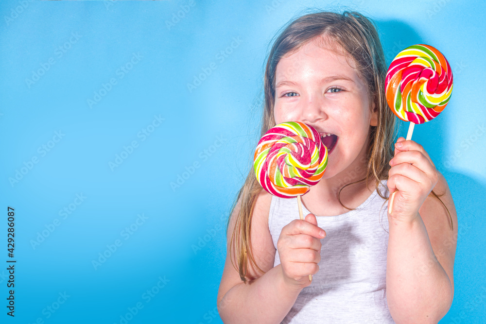 Little happy funny girl with big colorful lollypops, Holiday, happiness, summer vacation concept,