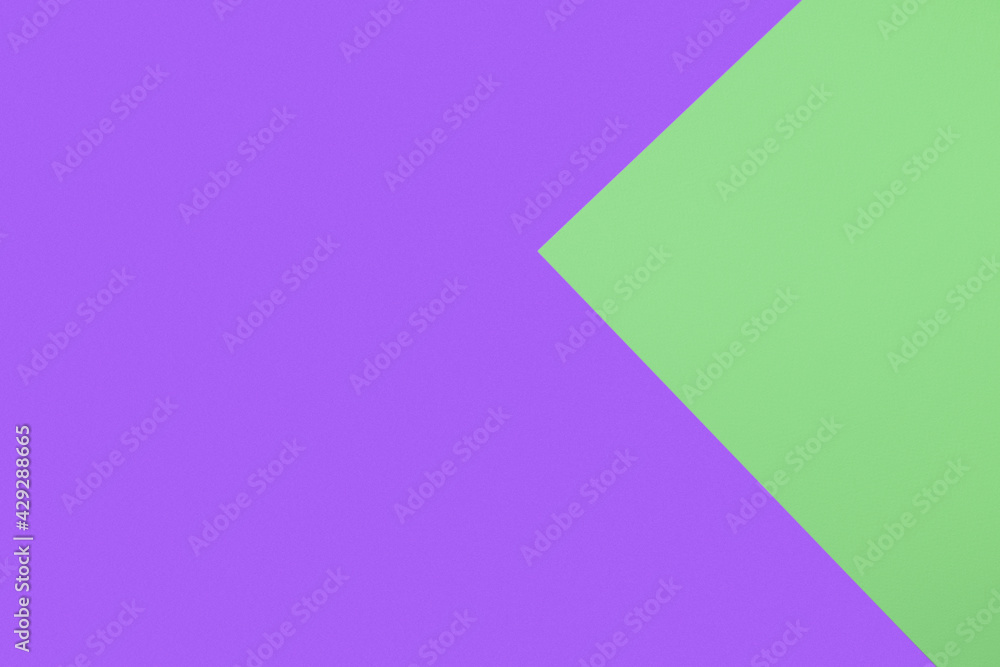 Geometric composition of two paper sheets with purple and light green colors. Texture background in vivid tone with copy space