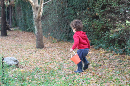 child with boots in autumn © Sebastin