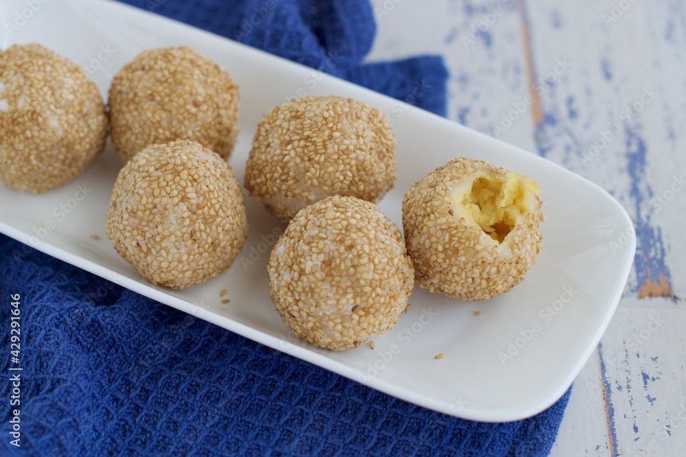 Sesame seed balls or Onde-onde. Indonesian traditional street food. glutinous rice flour stuffed with mung bean paste coated with sesame seeds