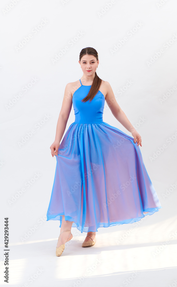 girl beautiful dress is engaged in dancing in the studio girl beautiful dress is engaged in dancing in the studio