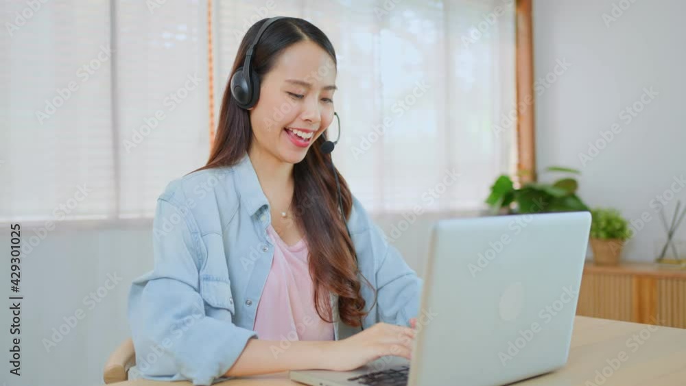 Asian female call center agent talking to customer, working at home. Asian female call center agent talking to customer, working at home.