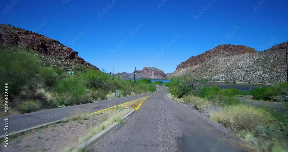 Brief Partial Lake View While Exiting Parking Lot With Stop Sign Stop Canyon Lake Arizona On Apache Trail Road Toward Apache Junction Az Brief Partial Lake View While Exiting Parking Lot With Stop Sign Stop Canyon Lake Arizona On Apache Trail Road Toward Apache Junction Az