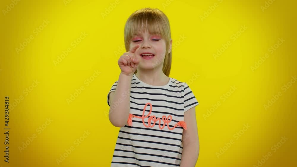 Hey, you. Funny playful blonde kid child smiling excitedly and pointing to camera, beauty choosing lucky winner, indicating to awesome you on yellow studio background. Teenager children girl emotions Hey, you. Funny playful blonde kid child smiling excitedly and pointing to camera, beauty choosing lucky winner, indicating to awesome you on yellow studio background. Teenager children girl emotions