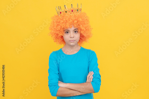serious teen girl in fancy clown wig wear queen crown, egocentric