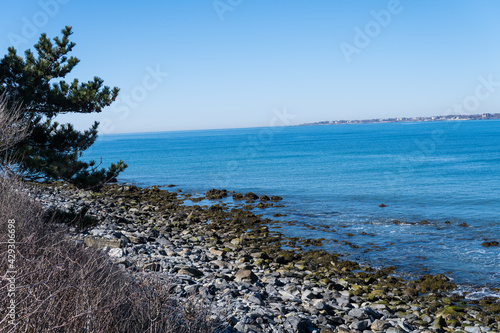 Rocky shoreline at New England beach. 