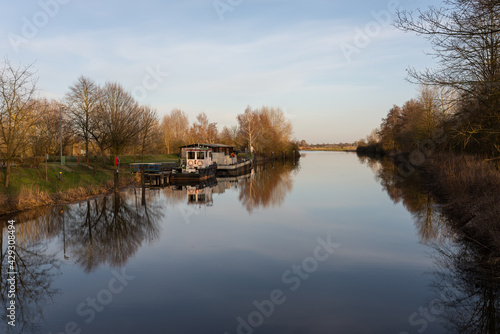 reflection of the trees in the river © JS_Fotoworx