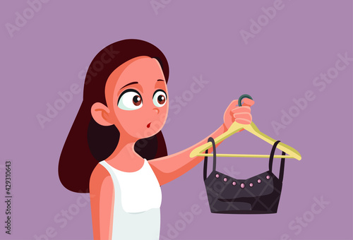 Teen Girl Holding a Crop Top on a Clothing Hanger