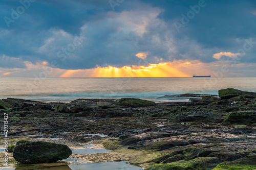 Clouds and a Sunrise Seascape with Rocky Foreshore