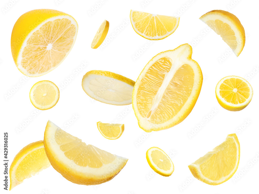 Fresh cut lemons flying on white background