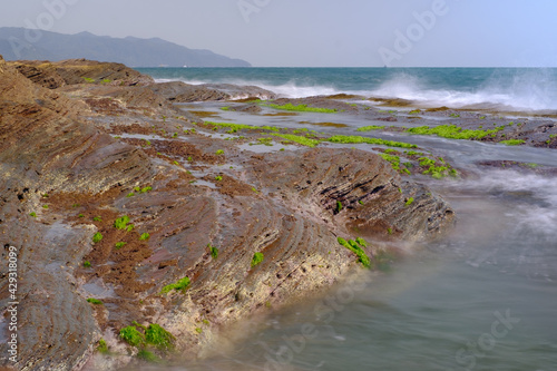 Waves crashing by the coast in Tung Ping Chau - the most remote island in Hong Kong, now part of the Plover Cove national park, Hong Kong.