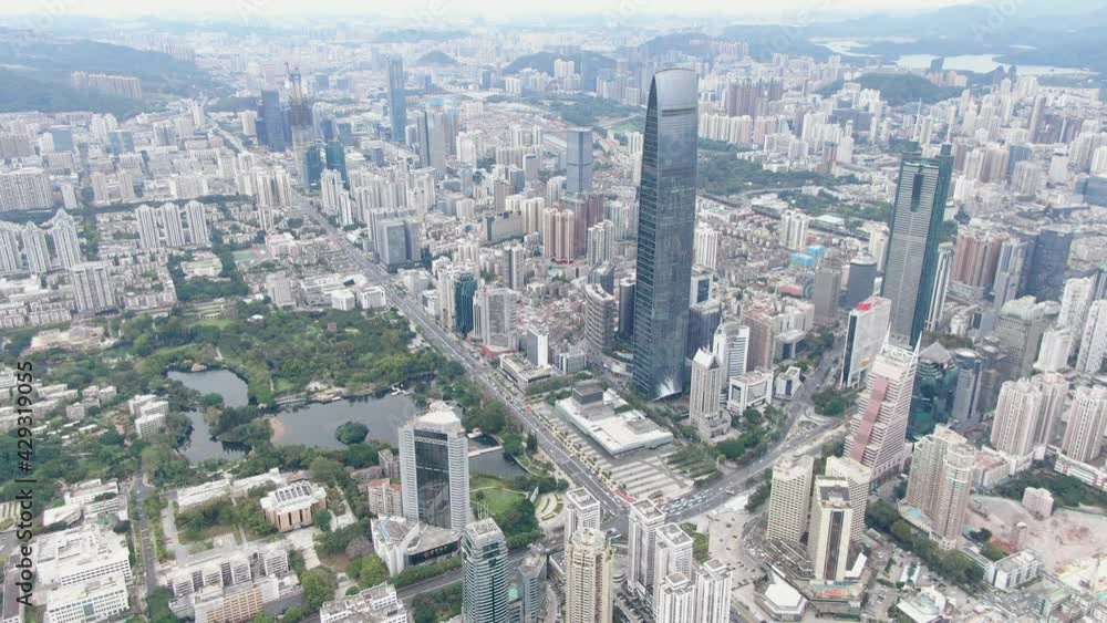 Aerial view over Shenzhen cityscape with massive urban development and skyscrapers. Aerial view over Shenzhen cityscape with massive urban development and skyscrapers.