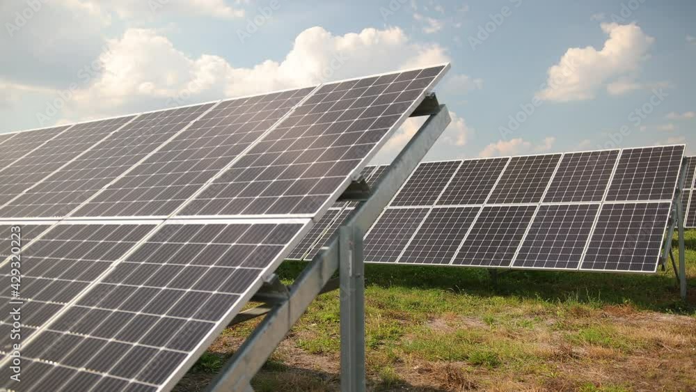 Solar panels against deep blue sky. Solar cells farm. Photovoltaic energy Solar panels against deep blue sky. Solar cells farm. Photovoltaic energy
