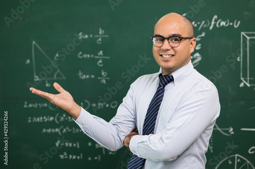 Young asian teacher man teaching video conference with student. Male Indian teacher training the mathematics in classroom from online course.