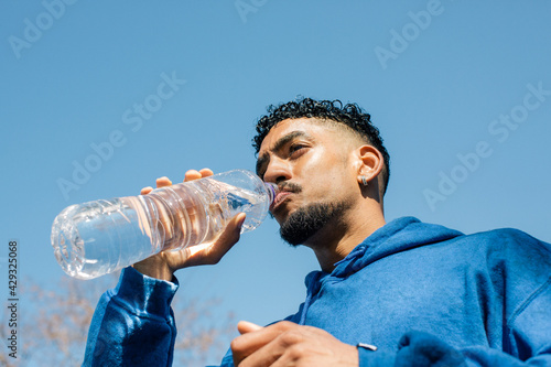 Man drinking bottle of water