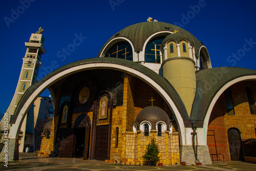 SKOPJE, NORTH MACEDONIA: Beautiful Orthodox Saint Clement of Ohrid Church against the blue sky in the center. photo