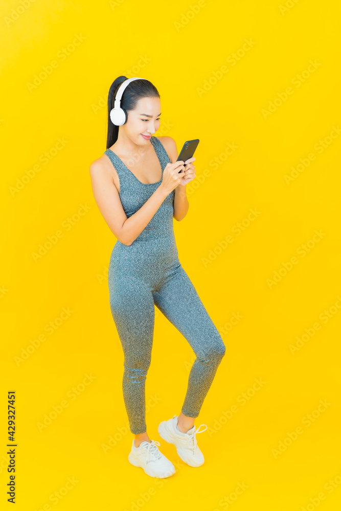 Portrait beautiful young asian woman with sportswear and phone Portrait beautiful young asian woman with sportswear and phone