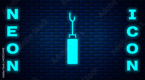 Glowing neon Awl tool with wooden handle icon isolated on brick wall background. Work equipment tailor industry. Vector
