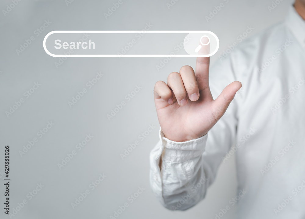 Man standing with hands pointing to information search is a data clicking to virtual internet search page computer touch screen. Education, Knowledge, Analysis the Internet to connect wirelessly. - obrazy, fototapety, plakaty 