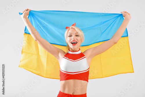 Beautiful cheerleader with ...