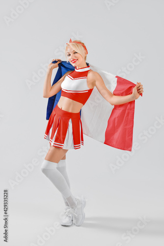 Beautiful cheerleader with ...