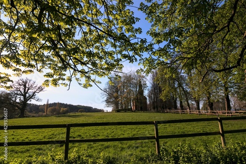 green paddock with chapel in spring