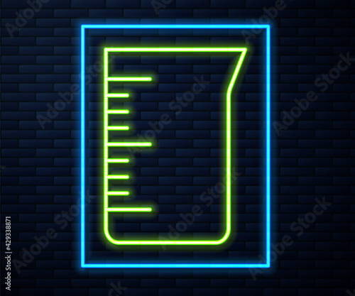 Glowing neon line Laboratory glassware or beaker icon isolated on brick wall background. Vector